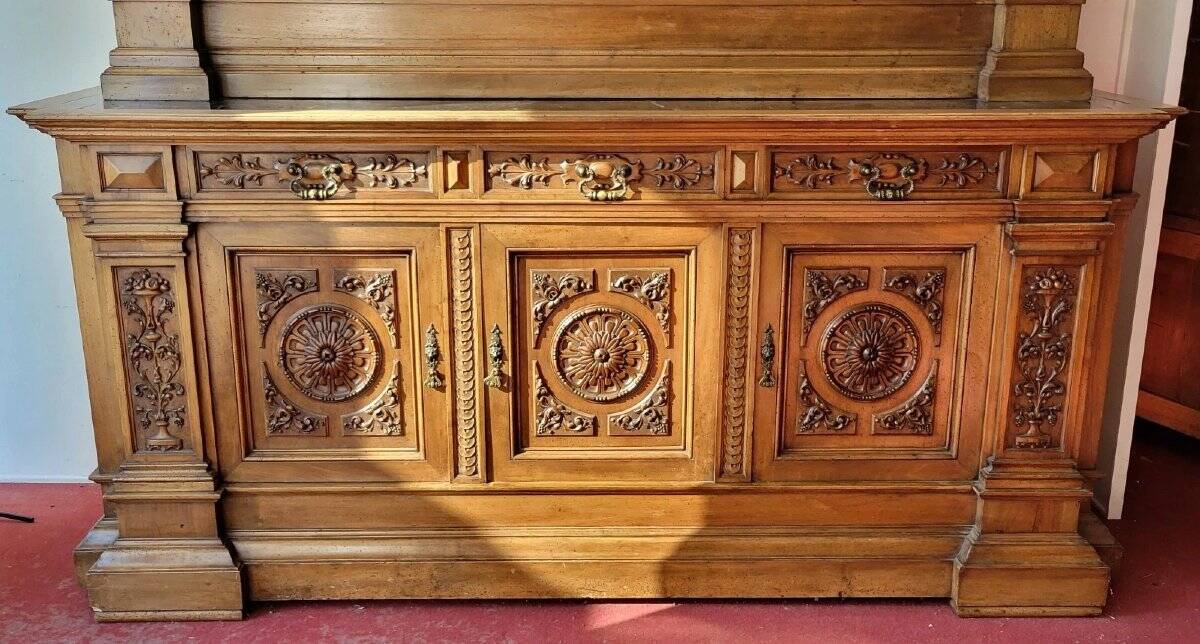 Two-body buffet, made of richly carved solid walnut.