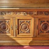 Two-body buffet, made of richly carved solid walnut.