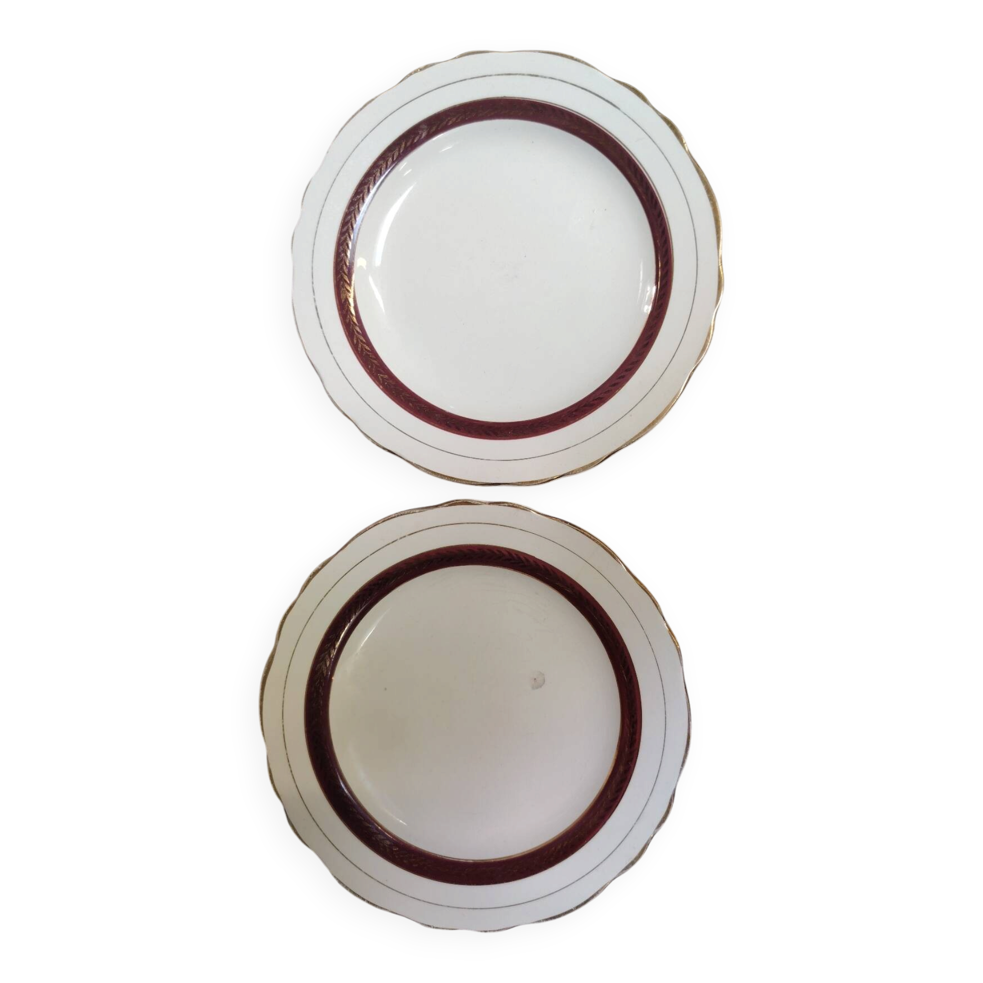 Salins white ceramic dessert plates with red trim and gold rim.