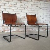 pair of tubular chairs in tawny leather