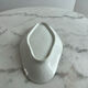 Oval white porcelain ramekin — raised floral pattern