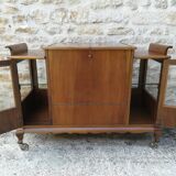 Bar cabinet on casters in walnut