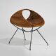 Rattan magazine rack with metal legs, 1950s