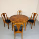 Round walnut Napoleon III extendable table with bronze top in good condition.