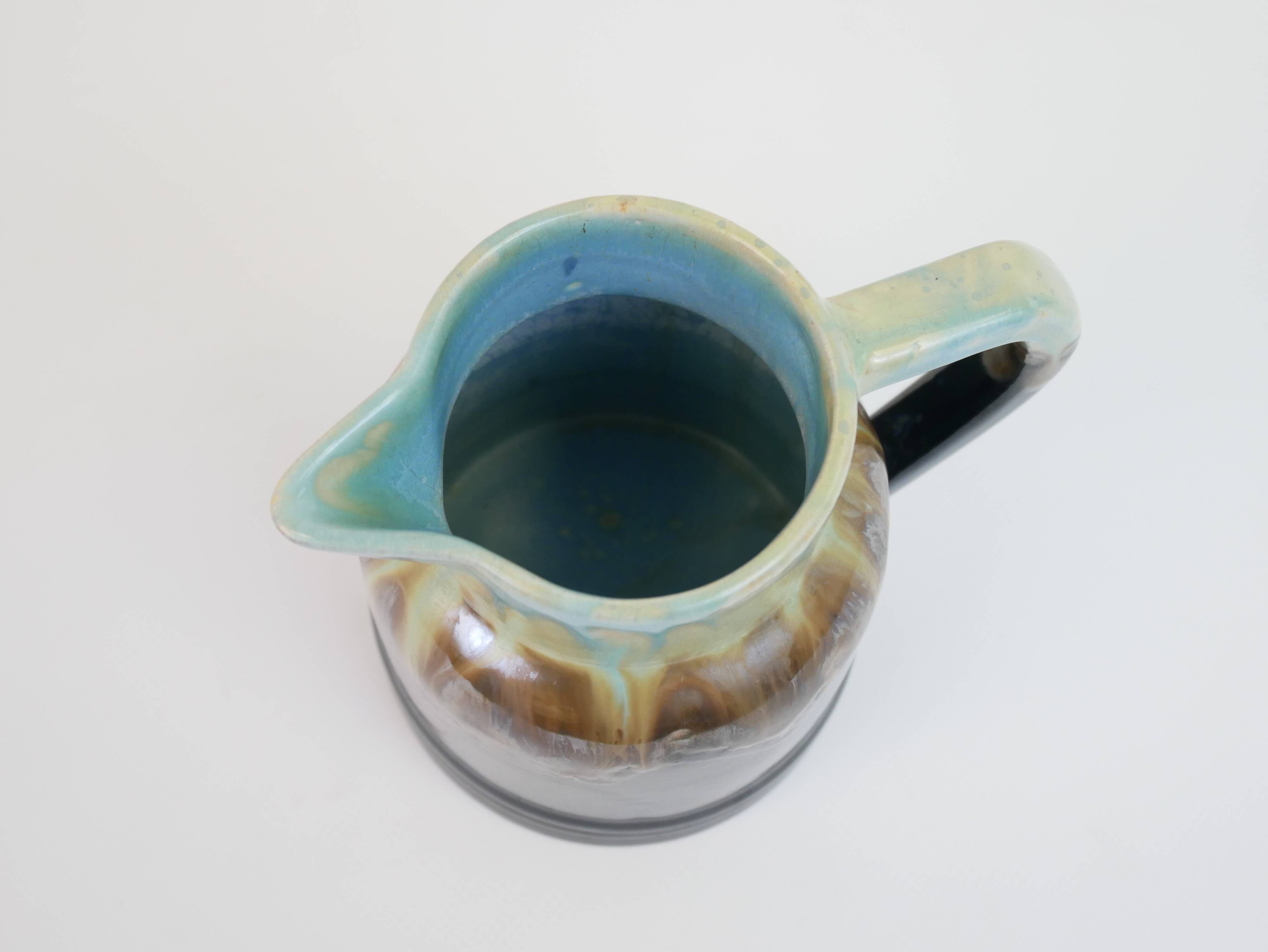 Art Deco pitcher in black, brown and blue glazed ceramic