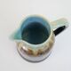 Art Deco pitcher in black, brown and blue glazed ceramic