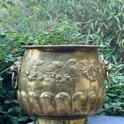 Large brass lion planter with a hallmark from the 19th century.
