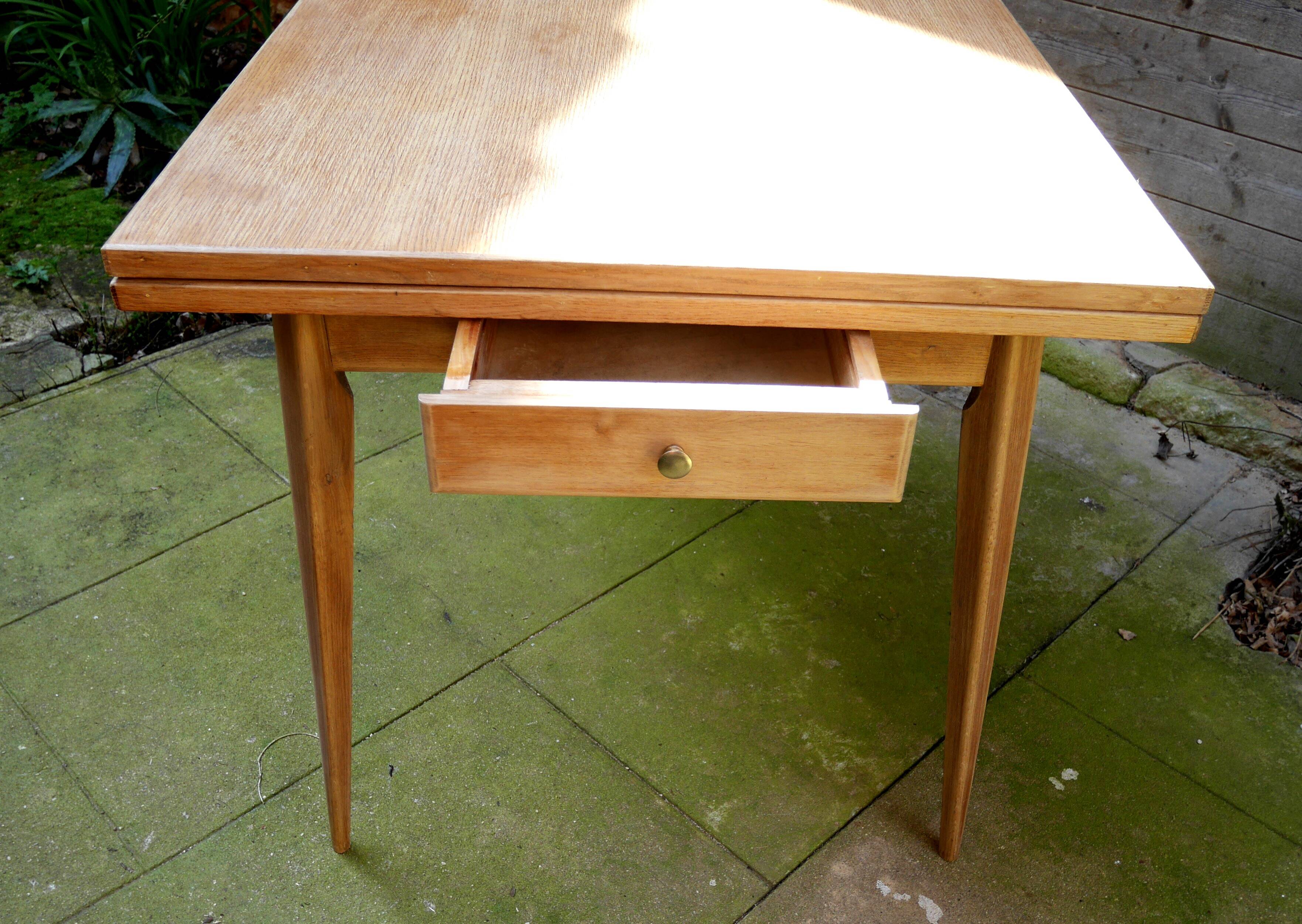 wooden dining table with compass legs and extensions