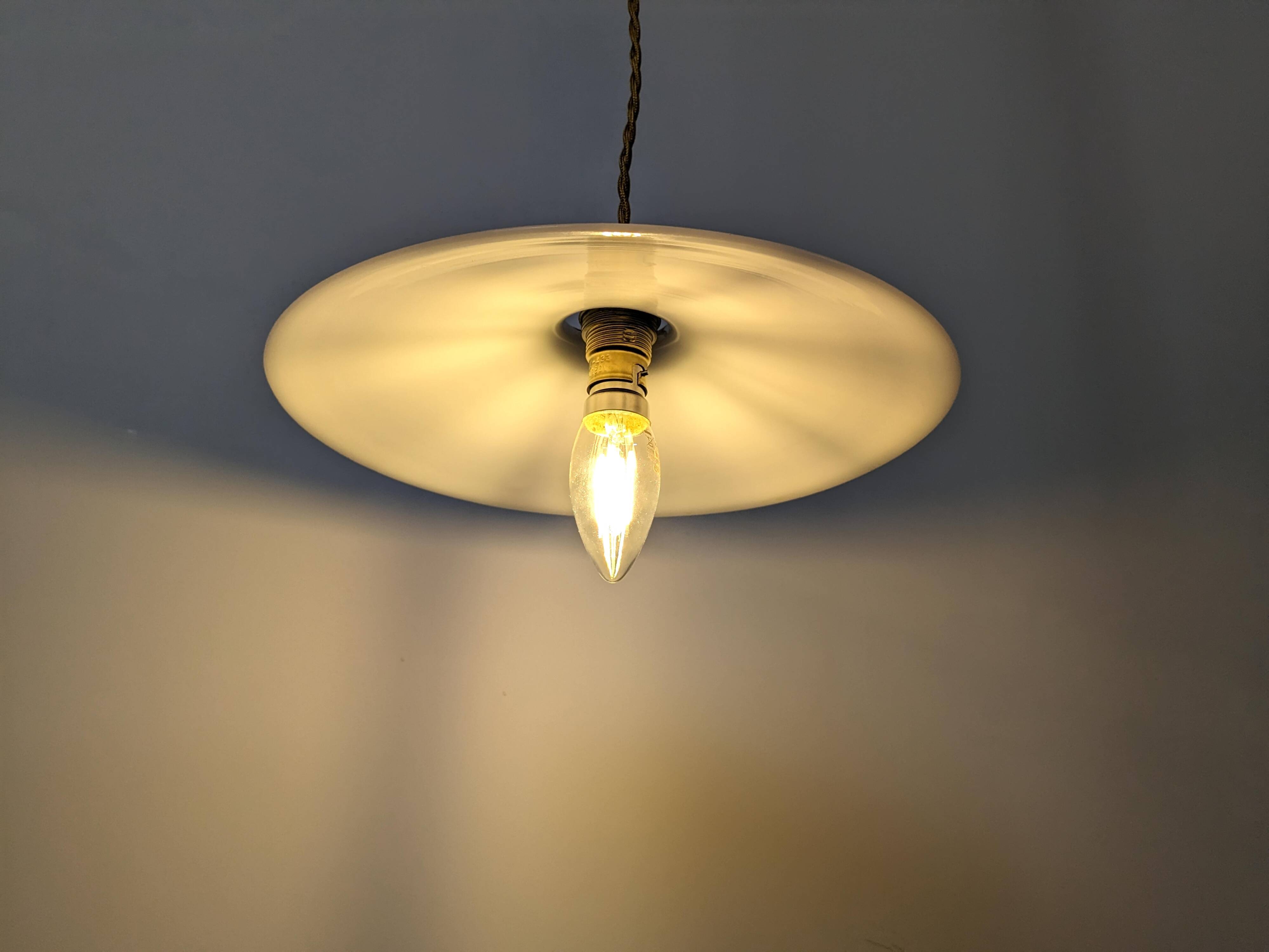 Vintage suspension in white opaline, elegant light fixture with soft light.