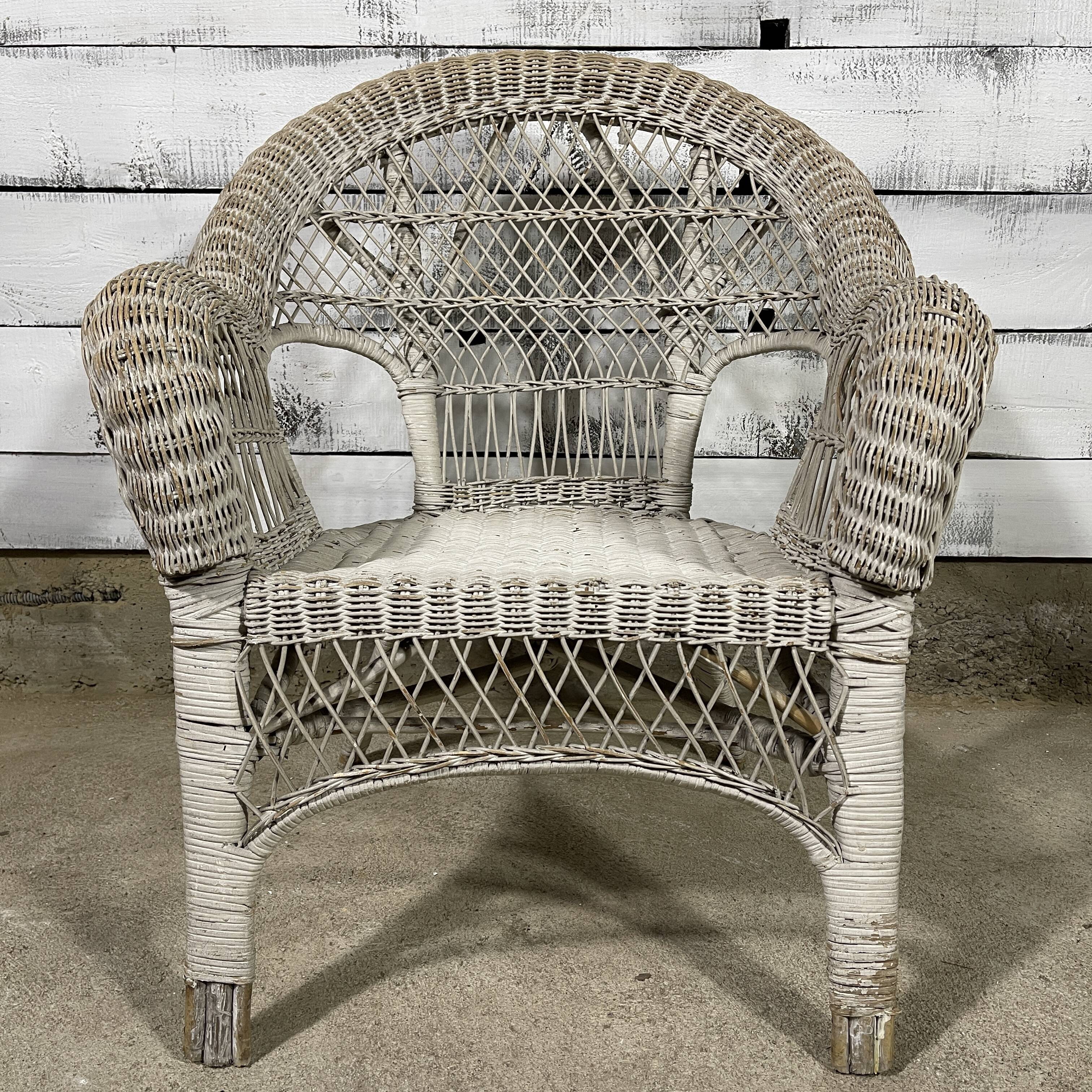 Vintage white rattan armchair