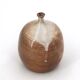 Ovoid vase with a small neck in brown beige ceramic and white drips.