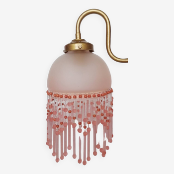 Pink glass wall lamp with garland of pearls