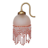 Pink glass wall lamp with garland of pearls