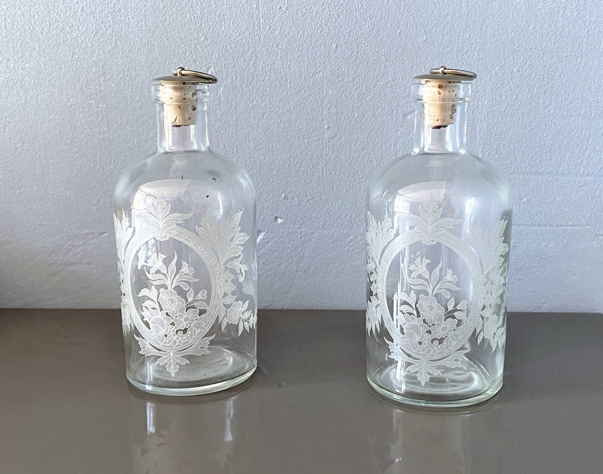 Pair of antique wheel-engraved glass bottles - good condition