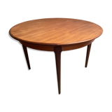 Round dining table with Scandinavian and Danish design in extendable teak from the 60s