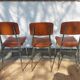 3 chaises vintage en inox et simili-cuir marron
