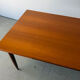 Rectangular extendable dining table with Scandinavian design in teak.