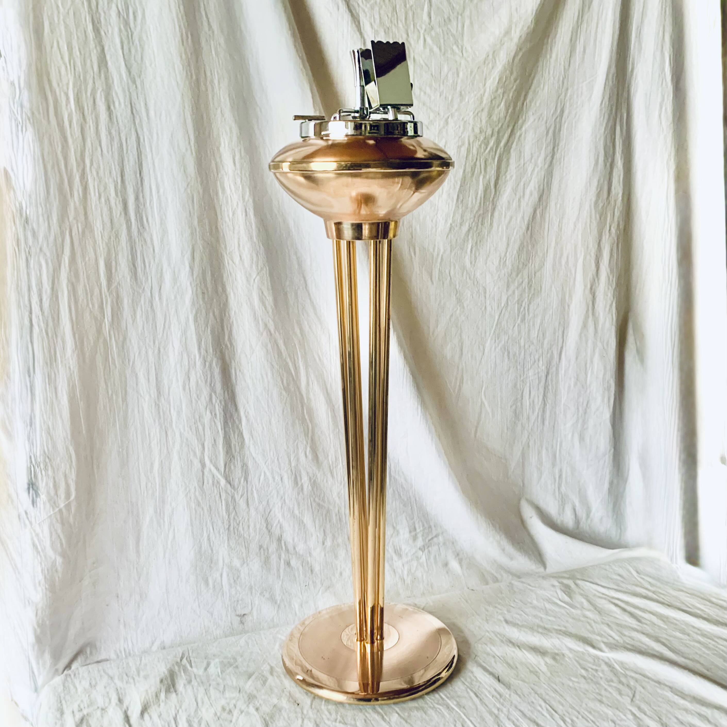 Old brass and chrome-plated metal ashtray on stand