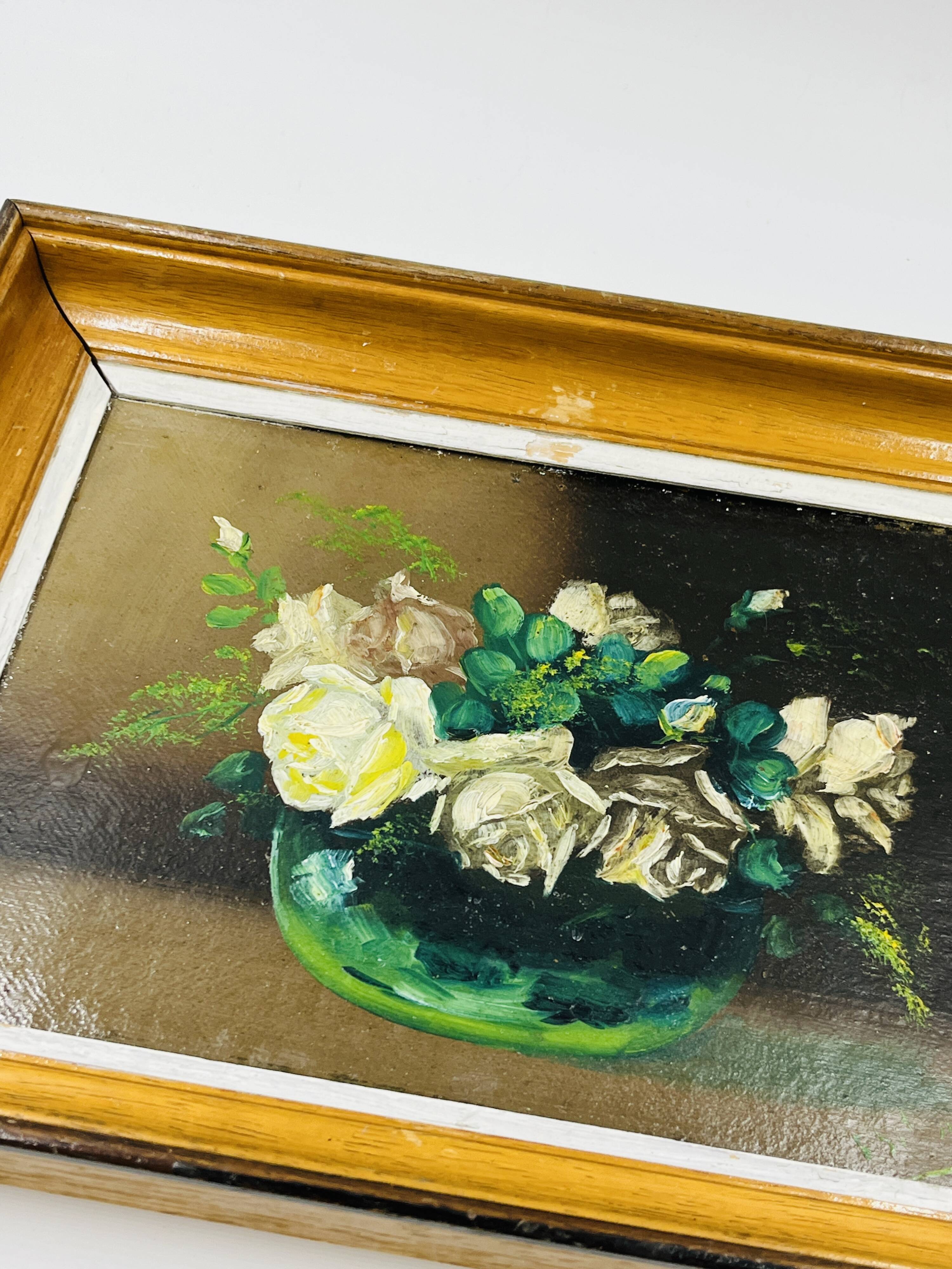 Pair of small framed vintage floral oils