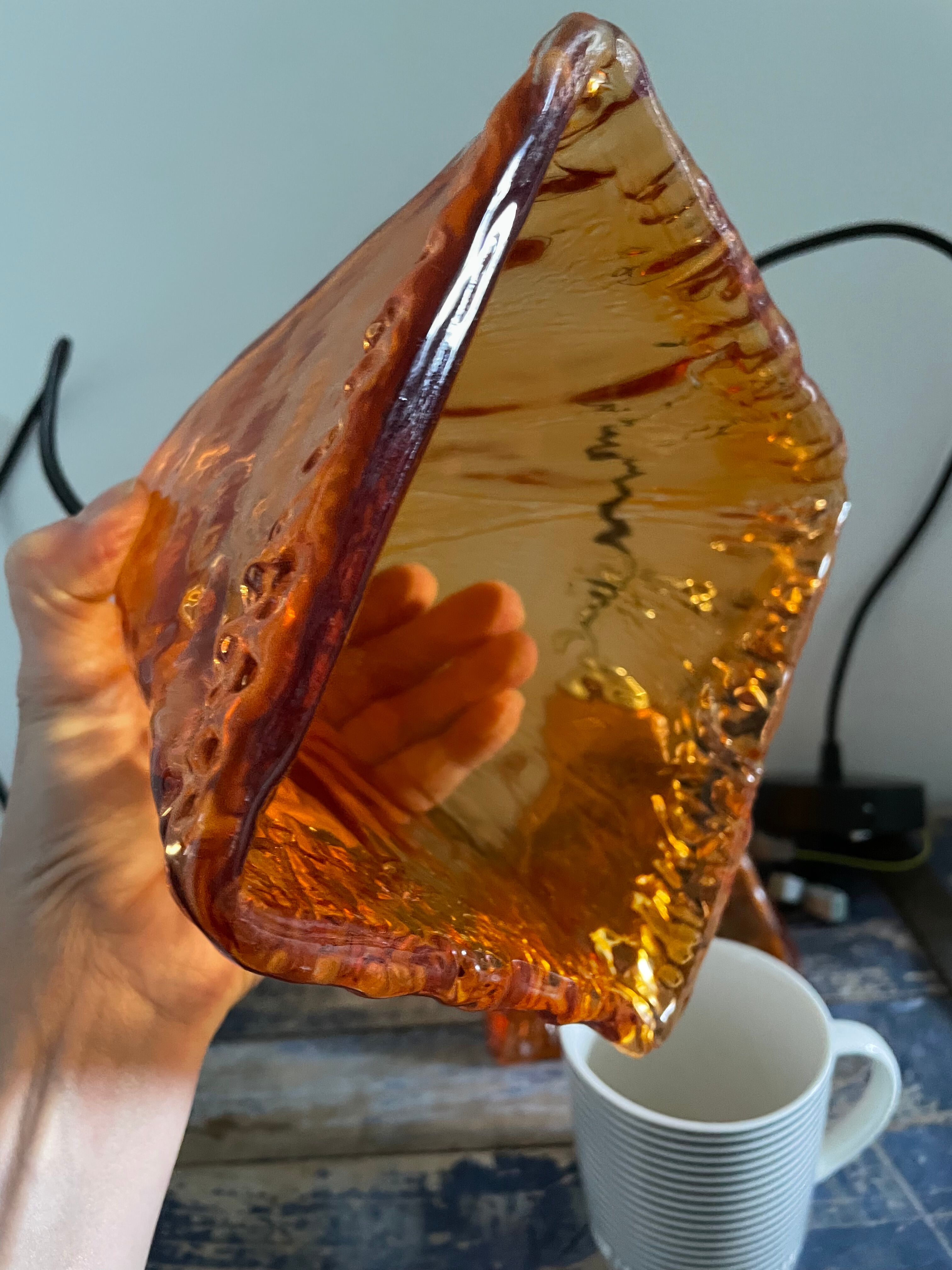 Set of two amber glass hanging lamps