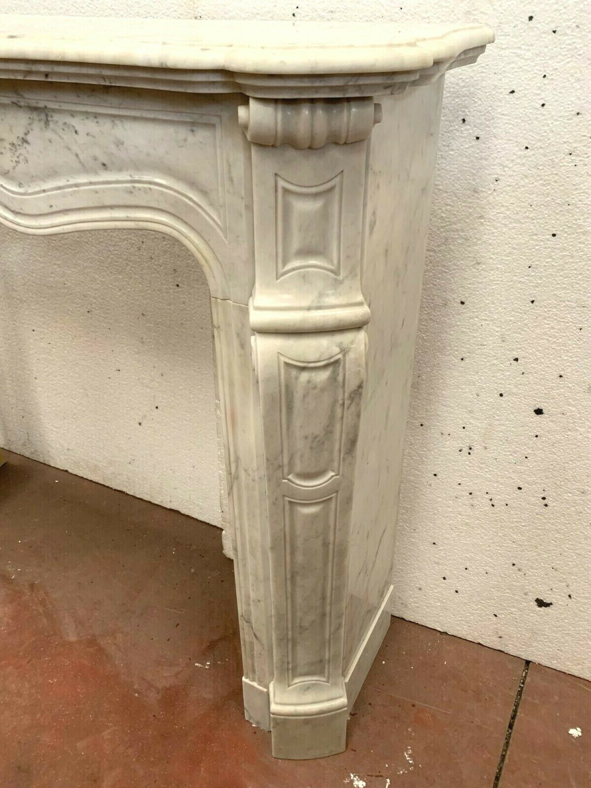 Louis XV style fireplace in white marble veined Carrara Italy 20th century