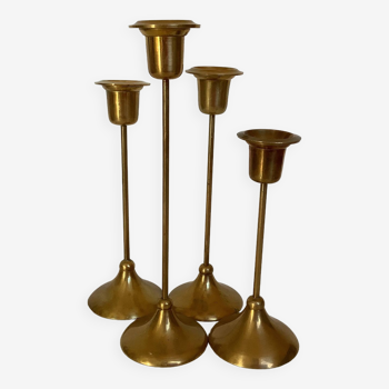 Four tulip-footed brass candlesticks
