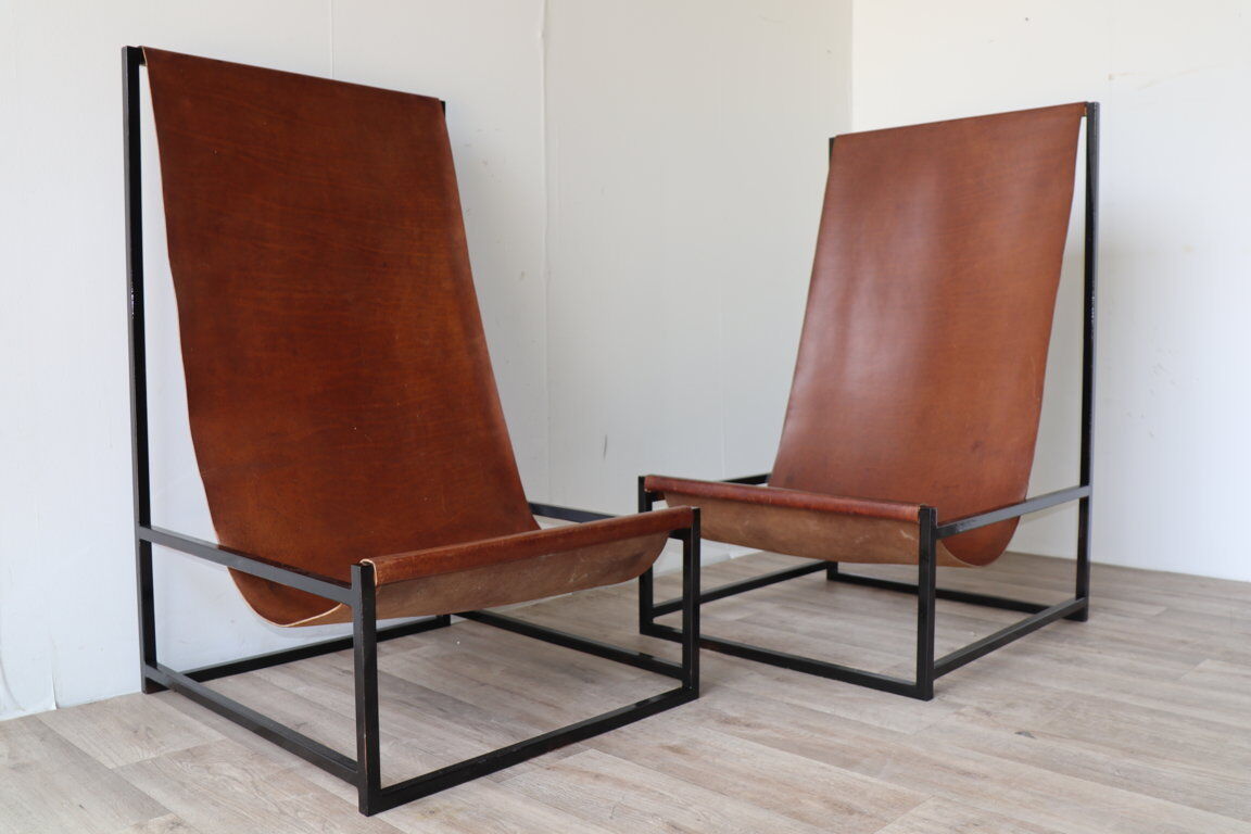 Pair of vintage armchairs in stretched leather and metal structure