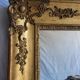 Antique Louis Philippe style gilded mirror decorated with floral motifs