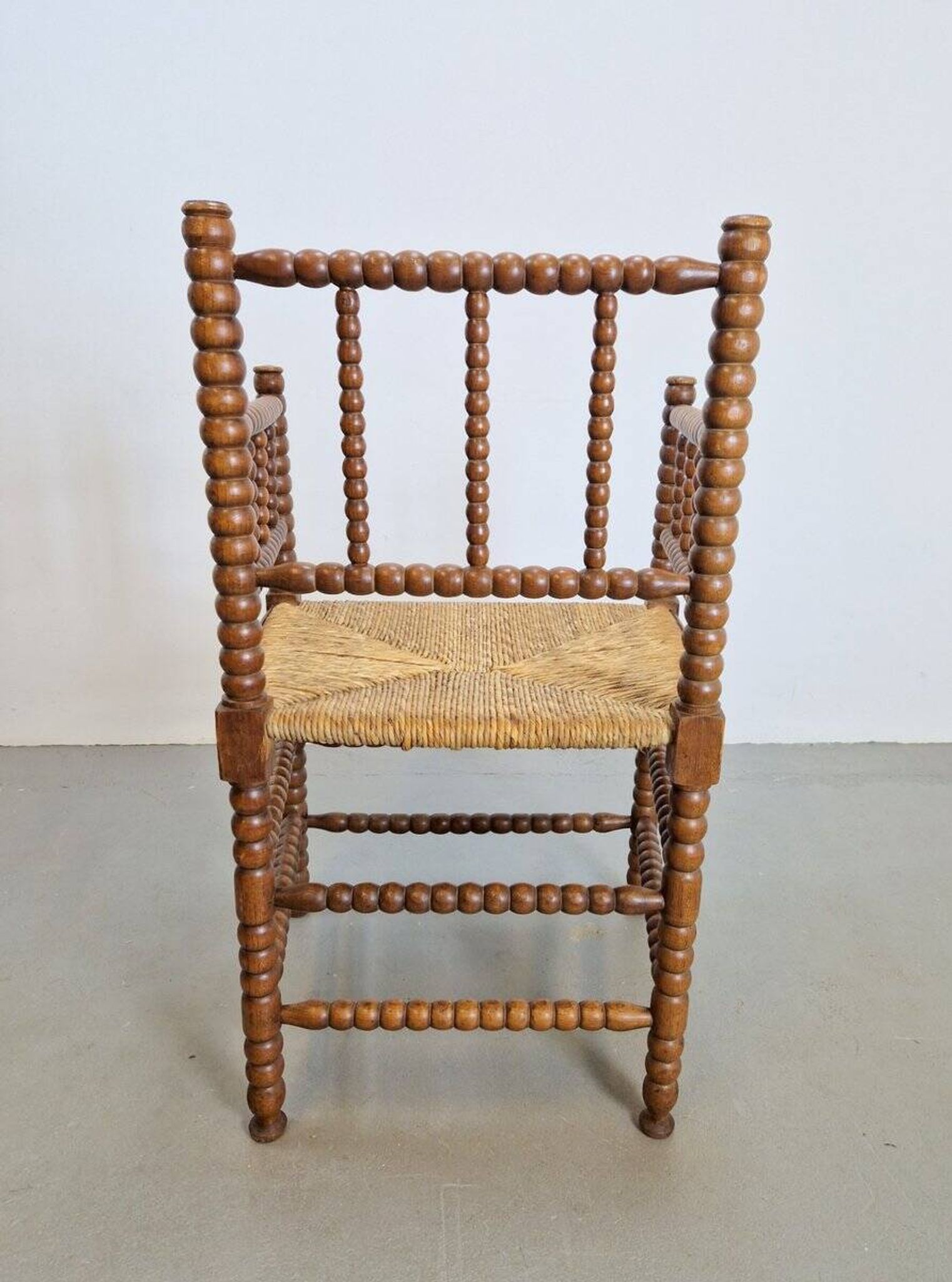 Mid-Century Arts and Craft Oak Bobbin Chair with Rush Seat, 1930s
