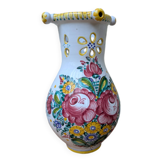 Old terracotta vase with handmade flower bouquet decoration