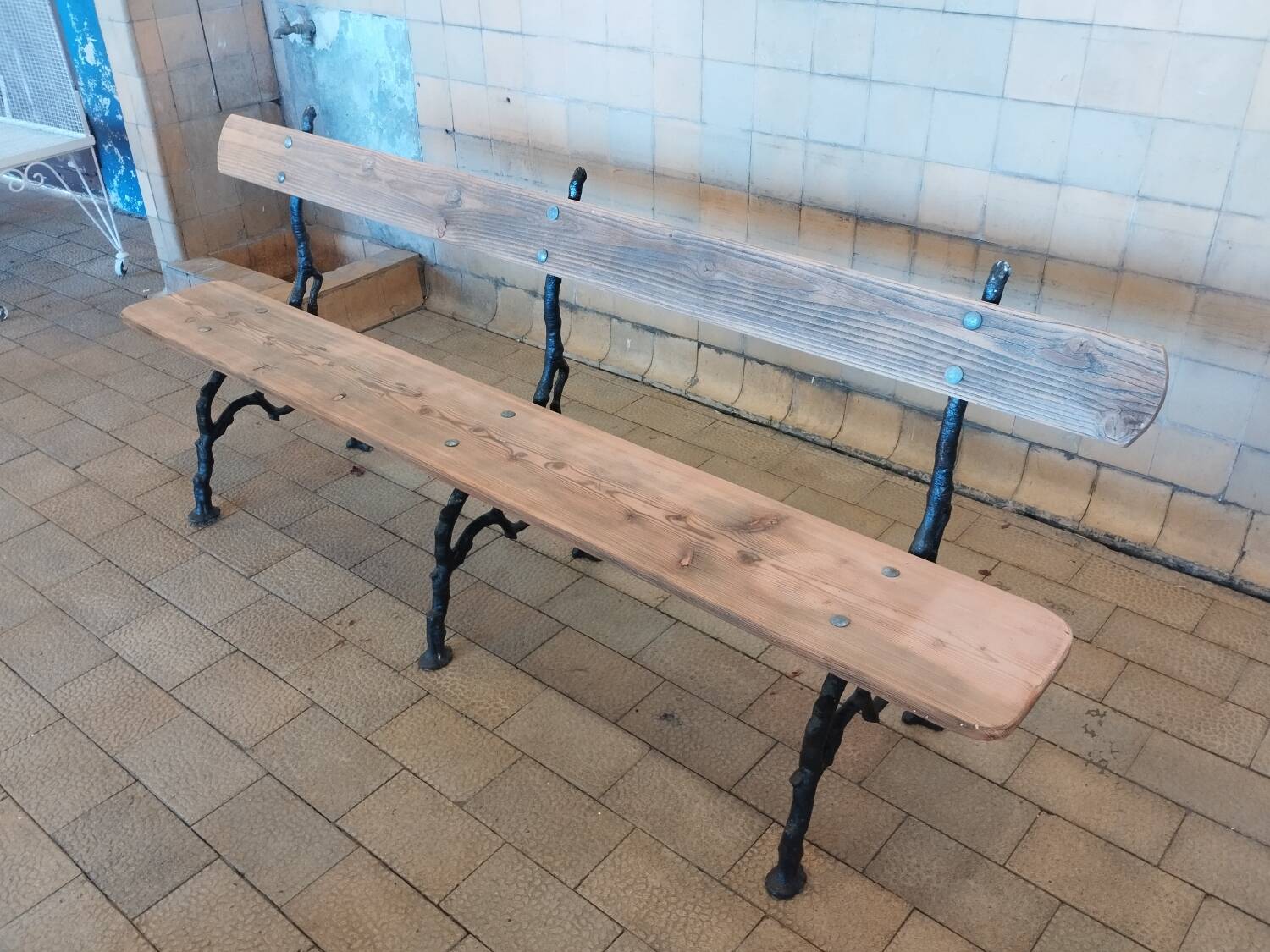 Antique garden bench with cast iron legs