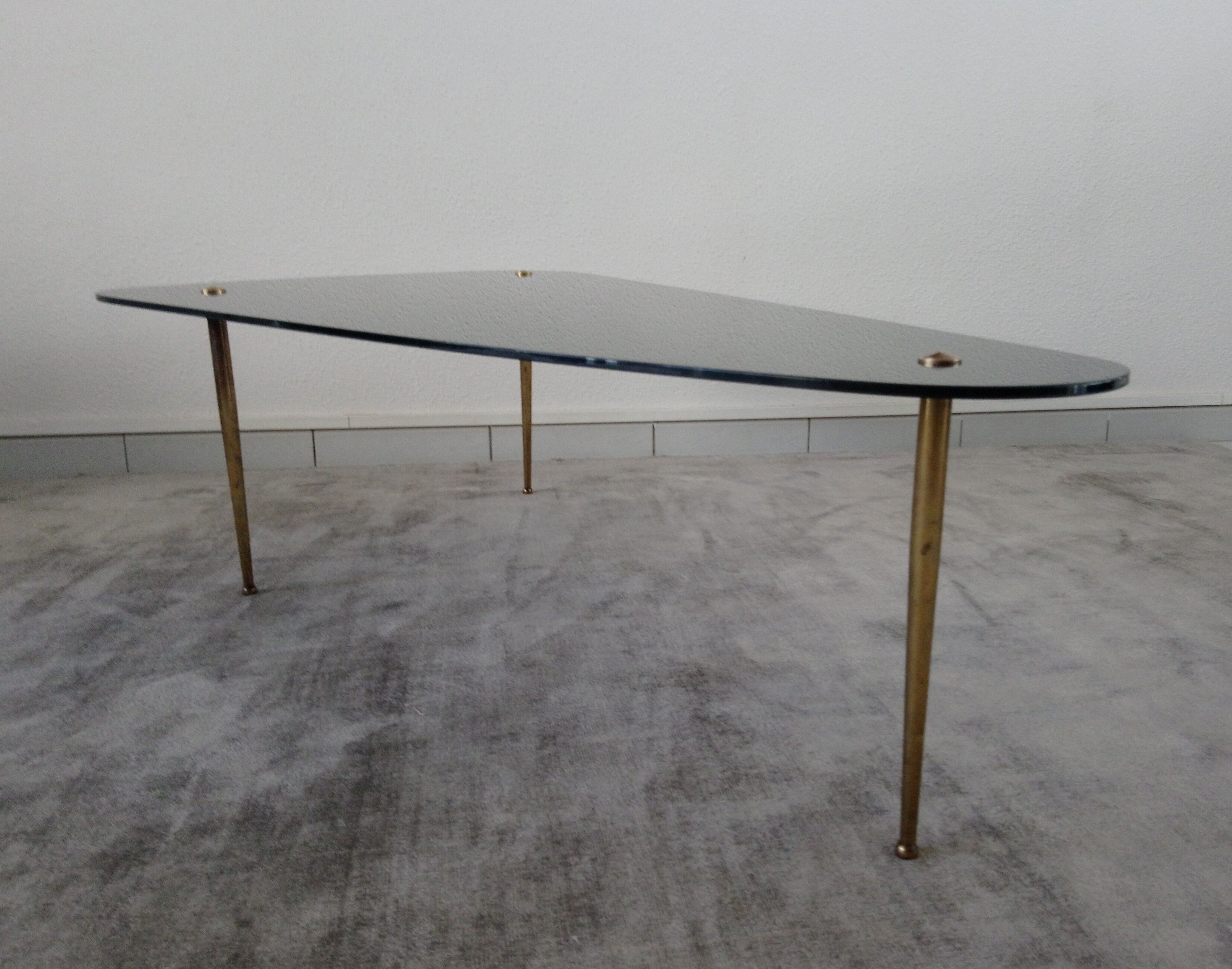 Tripod vintage black glass coffee table