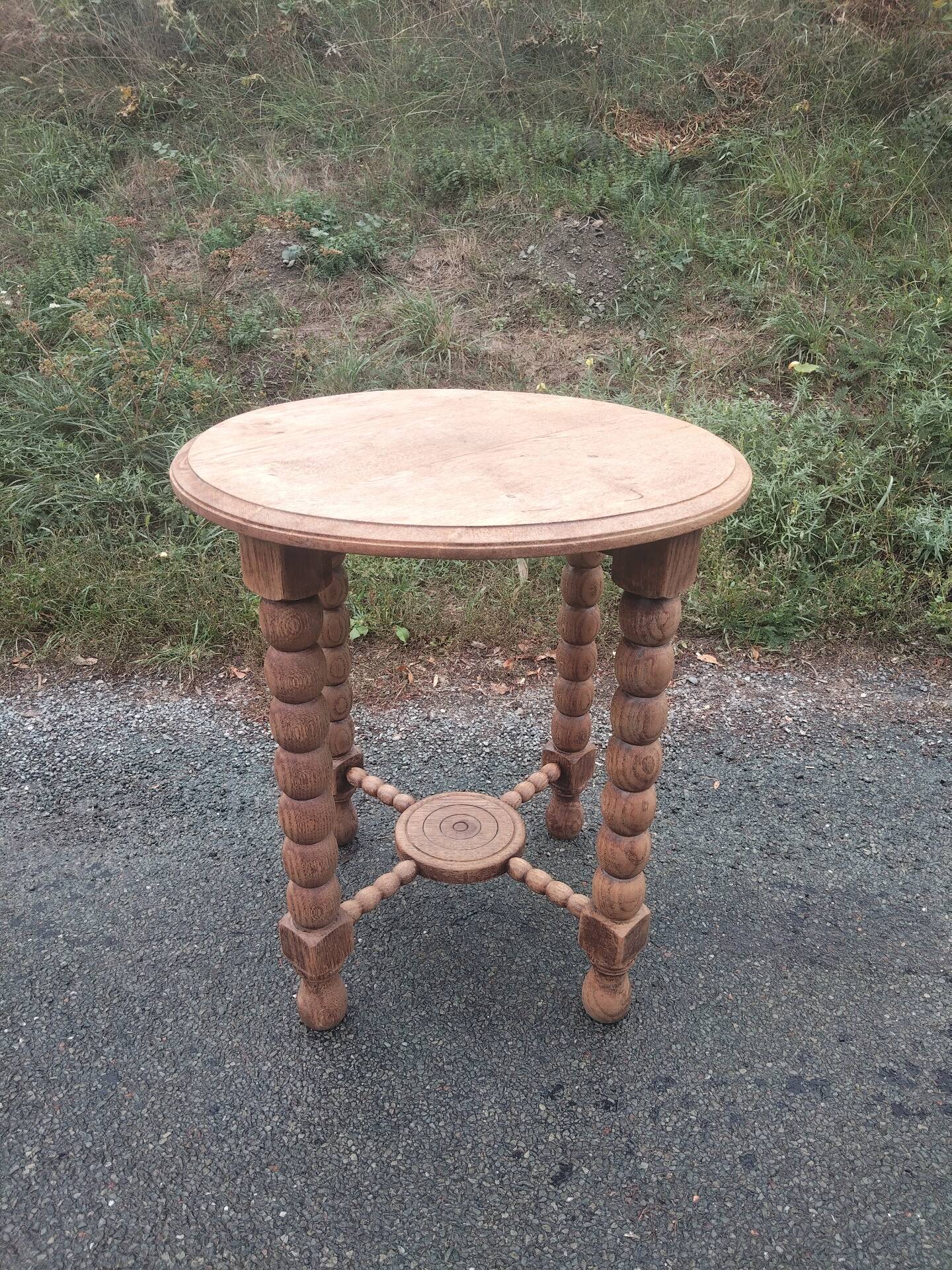 Oak gueridon in the style of Charles Dudouyt, 1940-50.