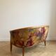 Two-seater banquette in Louis XV style made of wood and floral fabric.