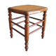 Antique wooden stool with cane seat.