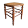 Antique wooden stool with cane seat.