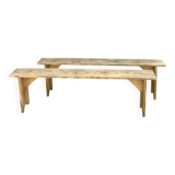Pair of old farmhouse benches made of raw solid wood.