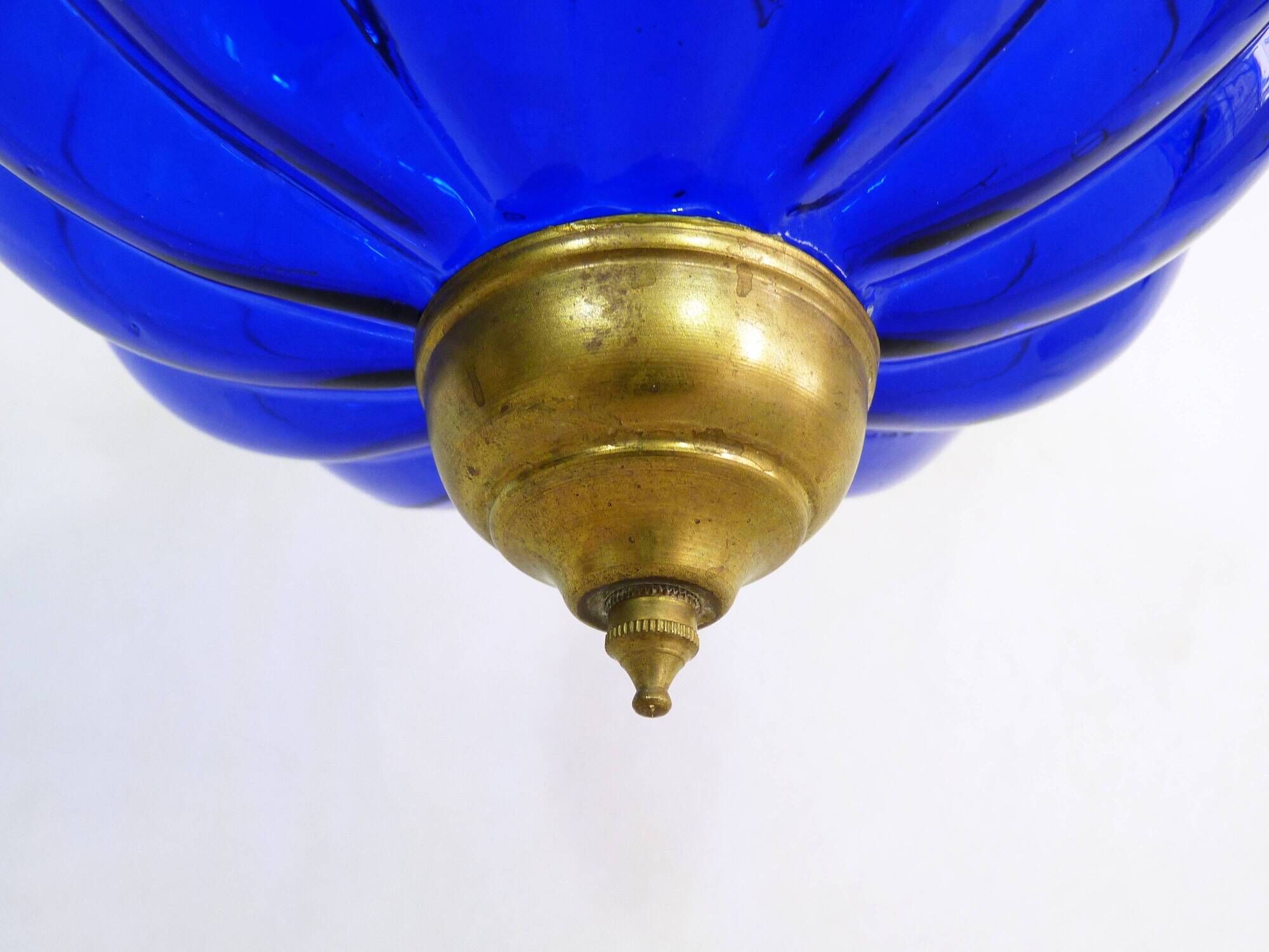 Suspension chandelier, oriental blue glass lantern and brass structure. Year 70-80