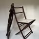 Set de quatre chaises pliantes en bois et cannage