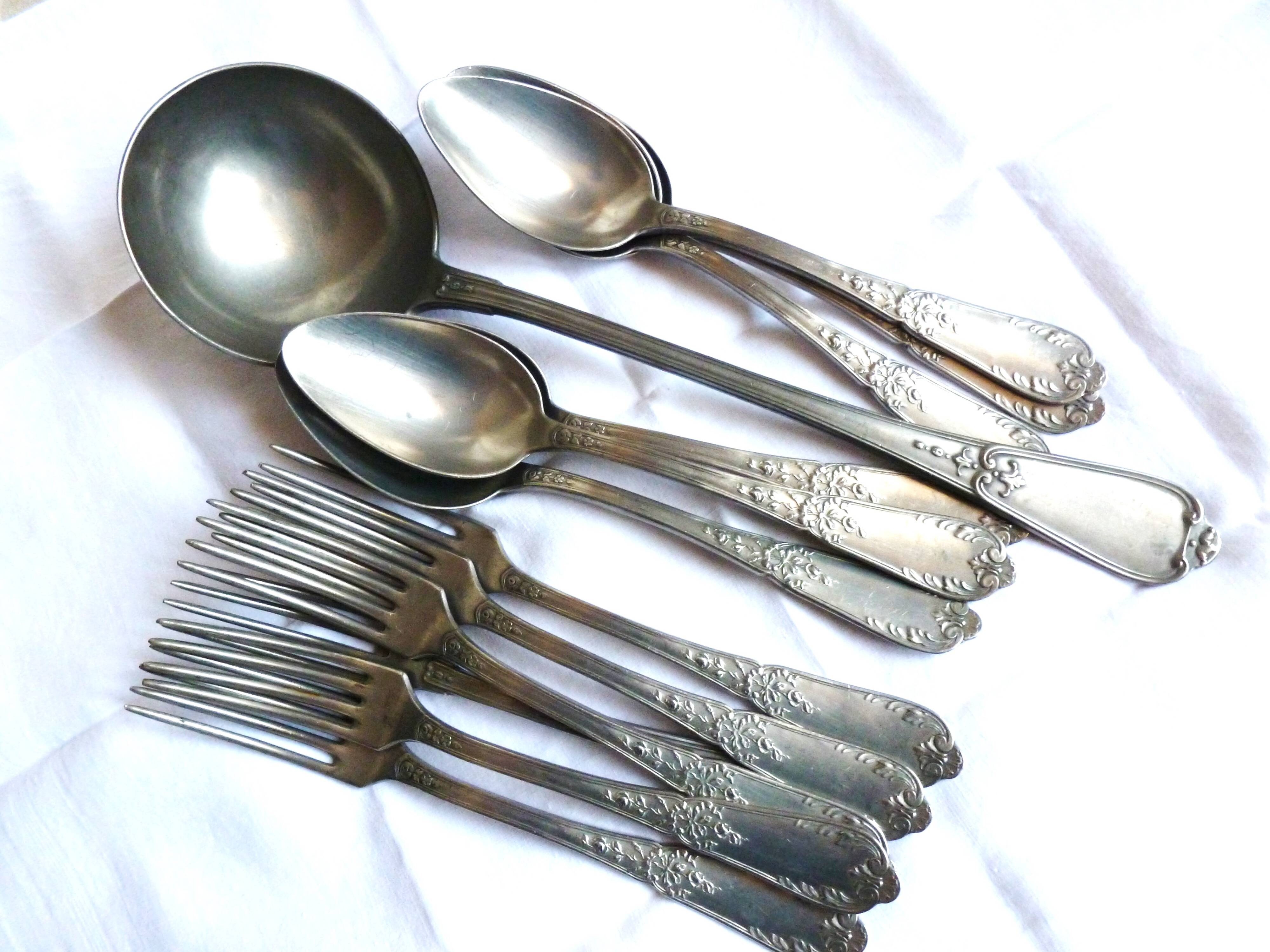Art Nouveau cutlery with ladle, forks, spoons and ladle