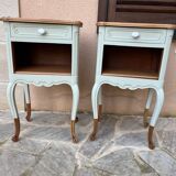 Renovated bedside tables in laurel green and light wood.