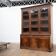Large glass-fronted library in rosewood from the 19th century.