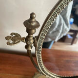 Swivelling brass mirror