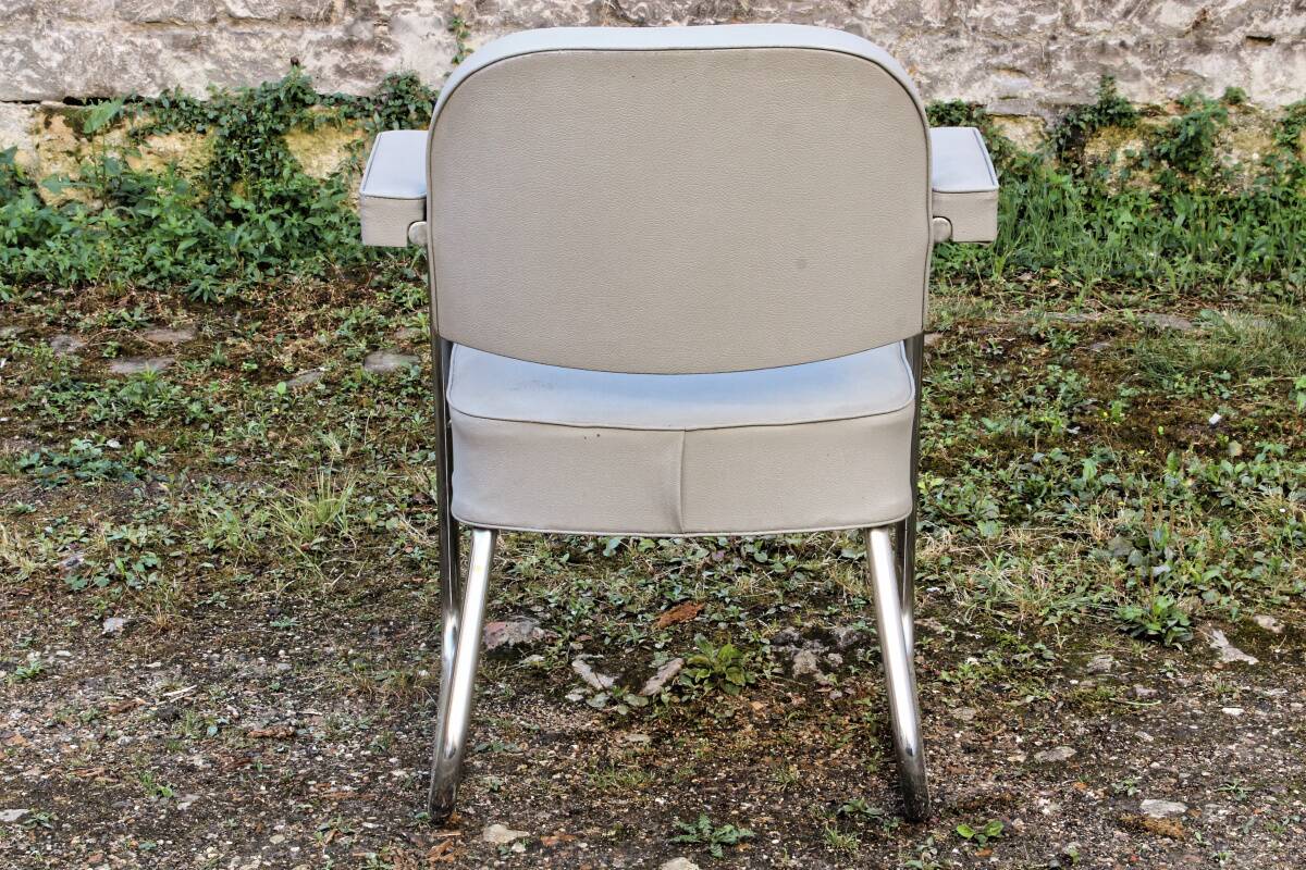 Set of 2 chairs and 1 armchair from the 70s in chrome metal and faux leather.