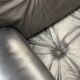 Pair of black leather armchairs