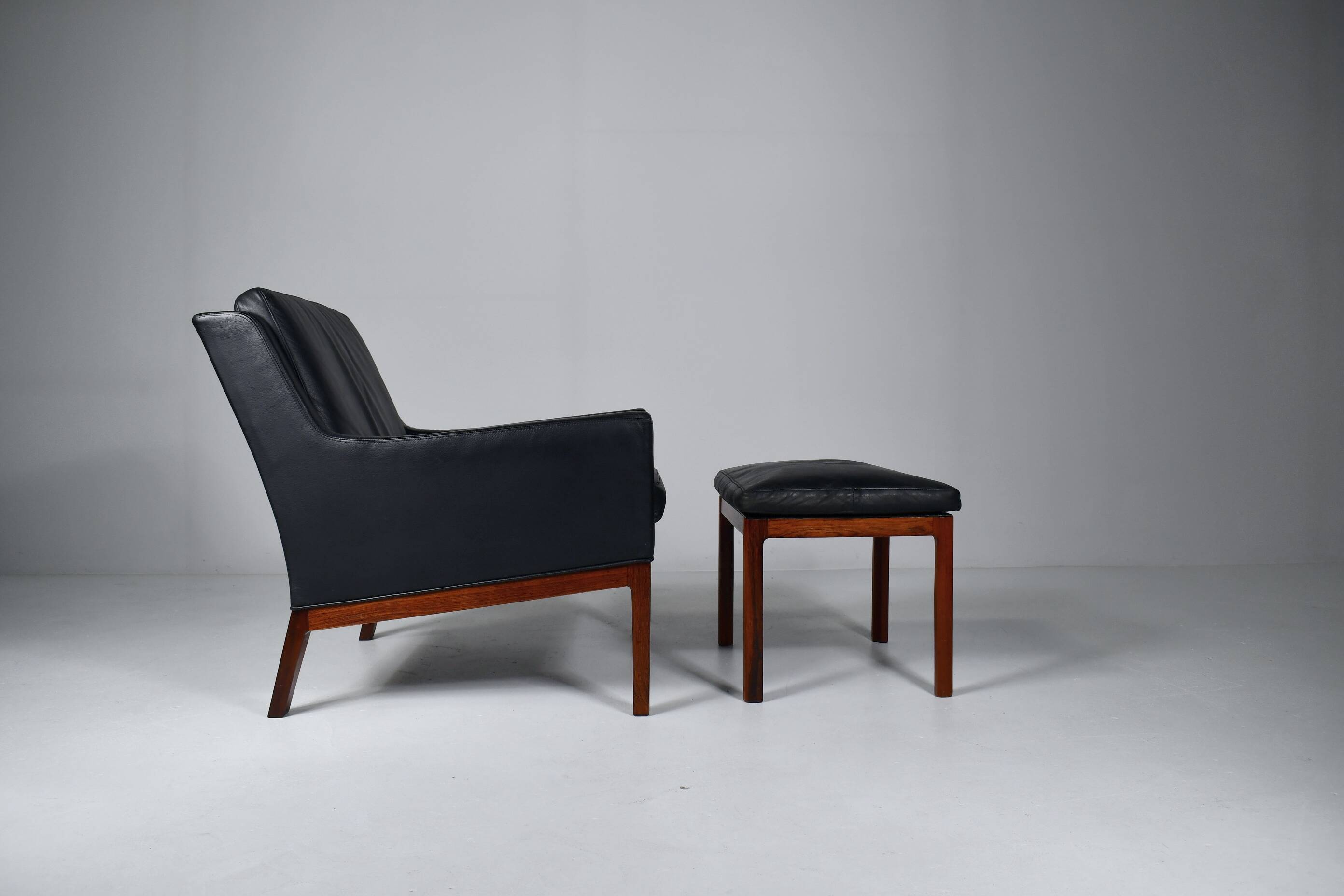 Leather armchair and footstool by Kai Lyngfeldt-Larsen. Denmark 1960s