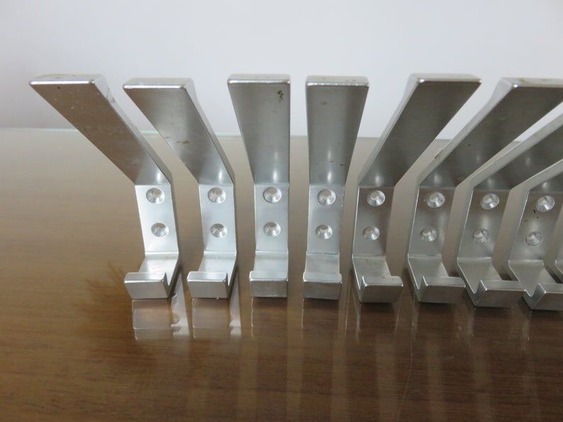 Series of 16 70s aluminium pads