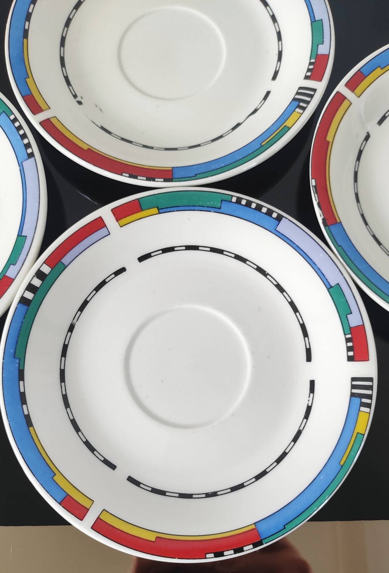 Set of small plates, vintage saucers in porcelain.