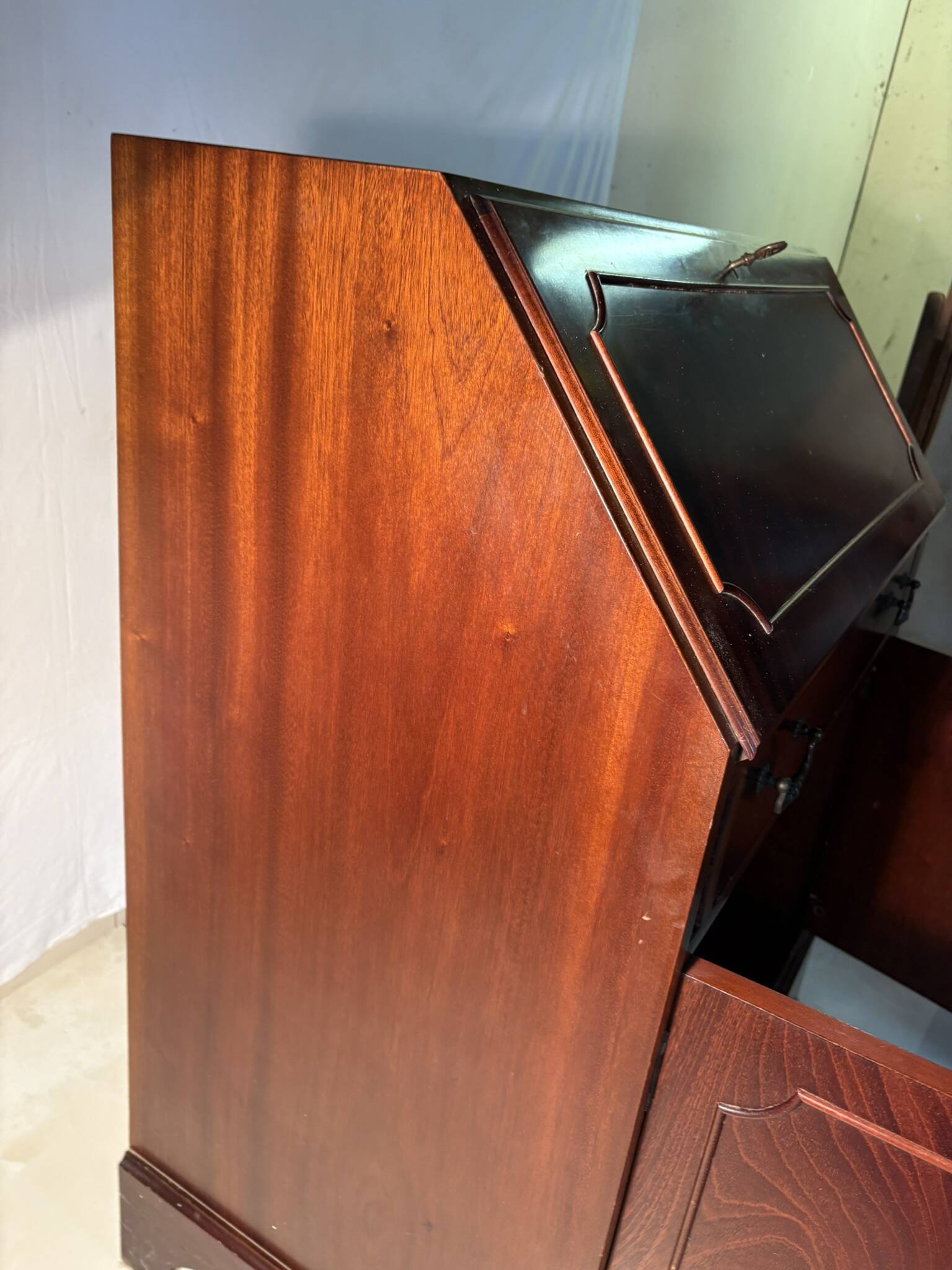 Antique mahogany secretary, upholstered flap and interior storage