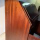 Antique mahogany secretary, upholstered flap and interior storage